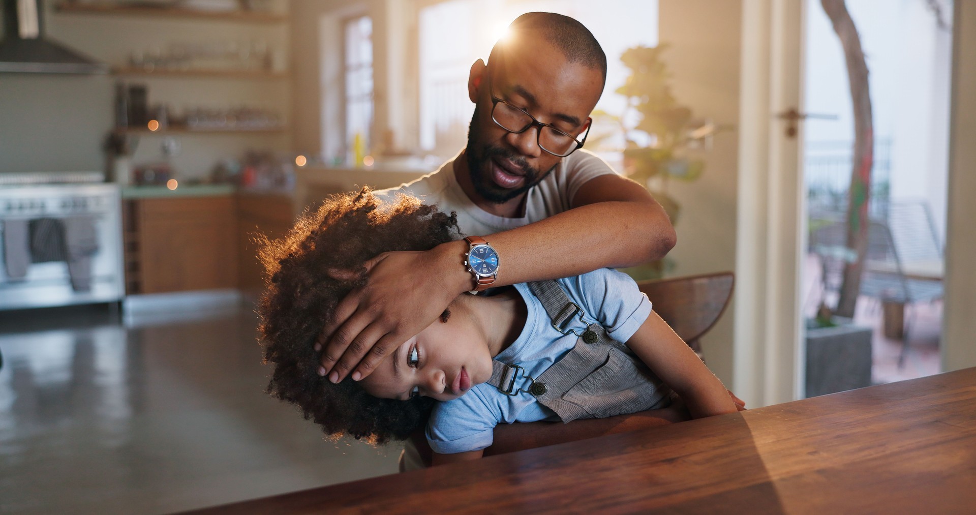 Father, child and headache for care, check or help with comfort, love or support in family home. Dad, pain and hand on sick kid for fever, temperature or touch for migraine with empathy in apartment
